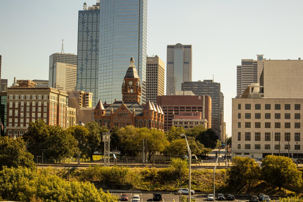 Real Estate Transactions & Litigation Scenic view of Dallas skyline featuring the Old Red Museum and skyscrapers.